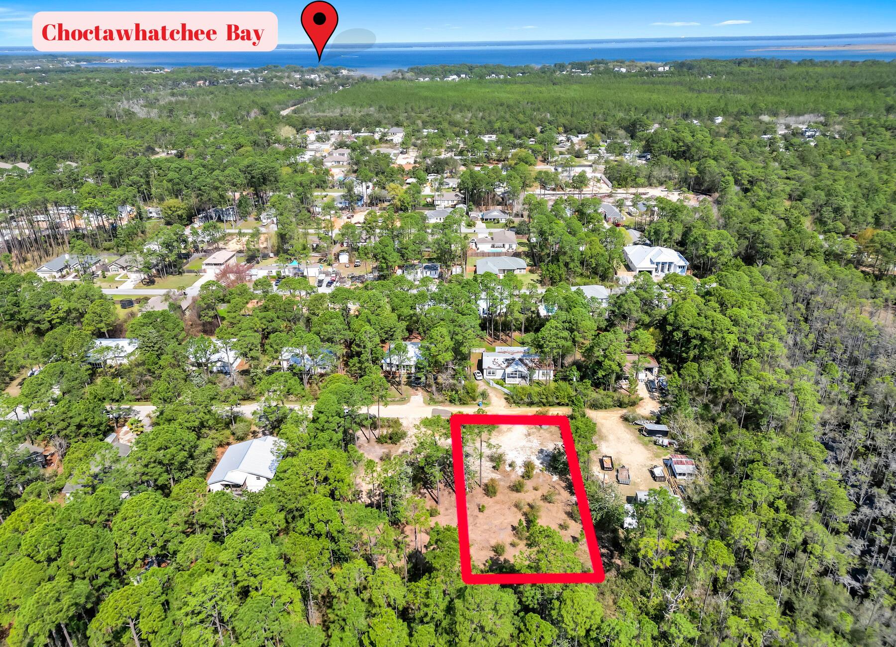 Check out this beautiful lot in a highly desirable area. It is perfect to build your dream home. No HOA fees and no build out time! Lot is in zone X and it is over a quarter acre. Lot also has been cleared and leveled. Walking distance from Walmart, 6 minutes from Sacred Hospital, Publix and Grand Boulevard and easy access to 30A and the beautiful beaches. Survey Available.