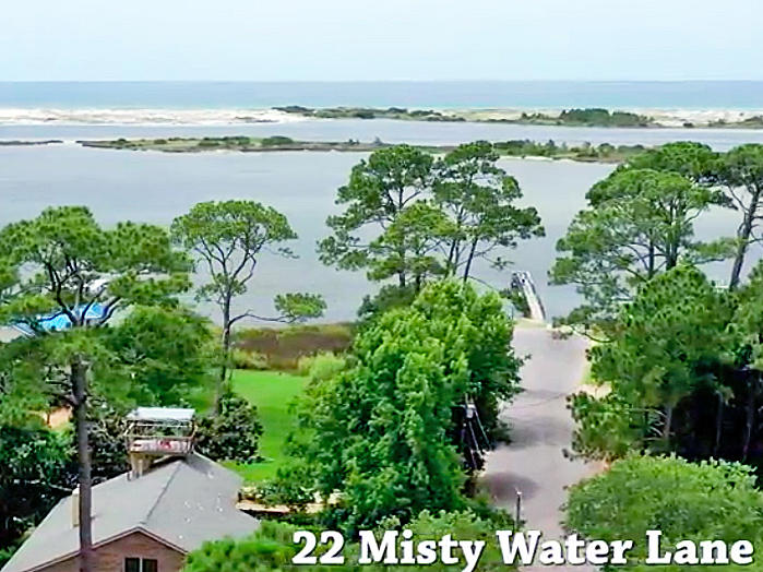 MAJOR PRICE IMPROVEMENT! Ready to build your custom Gulf-view home on this lovely half-acre wetlands lot on the Sound? Gorgeous sunrises and sunsets to start and end your days. Watch the dolphins, great blue herons, pelicans, jumping mullet...nature abounds! Make sure to view the aerial tour!All this lot needs is your personal touch! Federal permits have been secured for home and boardwalk which must be built on pilings, providing spectacular Gulf views, especially from a second story. There should be no problems with adding a pier and dock, or just use the public boat ramp right there at the end of the street. Come see this lot today, and make it your own!