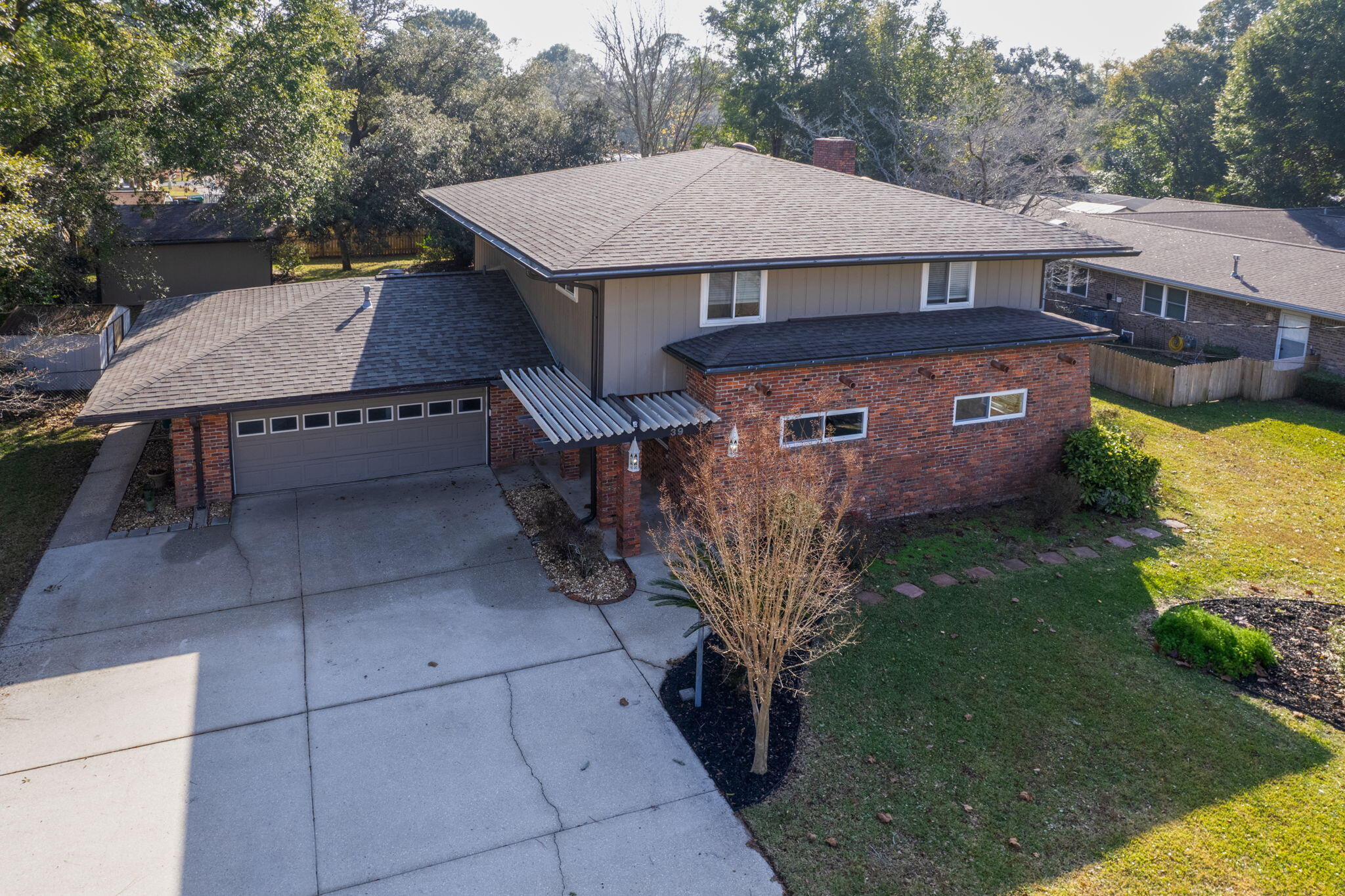 This charming 2 story home is located in the highly desirable Poquito Bayou neighborhood. Known for its atmosphere and close proximity to Eglin Air Force Base, Poquito Bayou is tucked away from the main part of town but still within minutes of necessities such and shopping and dining. The neighborhood also offers a unique opportunity for water access. Surrounded by the serene waters of Garnier Bayou and Poquito Bayou, the community is a haven for those who love the water. The Poquito Bayou Boat Ramp Park is a popular spot for boating and water activities, while Leo Norred Park provides a perfect setting for an afternoon of recreation and relaxation. In addition, it's also zoned for excellent schools like Longwood Elementary, Meigs Middle, and Choctawhatchee High School nearby. This house features hardwood floors in the living areas and tile in the kitchen. You'll find multiple spacious living areas, including a bonus room filled with natural light and views of the large backyard. The kitchen is equipped with stainless steel appliances, stone countertops, a gas stove, and a range hood. There's also extra counter and cabinet space perfect for a coffee bar or small appliances. The living room has a cozy gas fireplace with a stone surround, and there's plenty of recessed lighting throughout the home. For comfort, there are dual AC units which keeps both floors comfortable at their own temperature. The upstairs includes a large primary bedroom with a modern bathroom featuring a big tile shower, double vanity, and two roomy closets. Down the hall, there are three more spacious bedrooms and two storage closets. Outside, the yard is well-maintained and landscaped, and there's a large workshop shed with a garage door in the backyard. 
