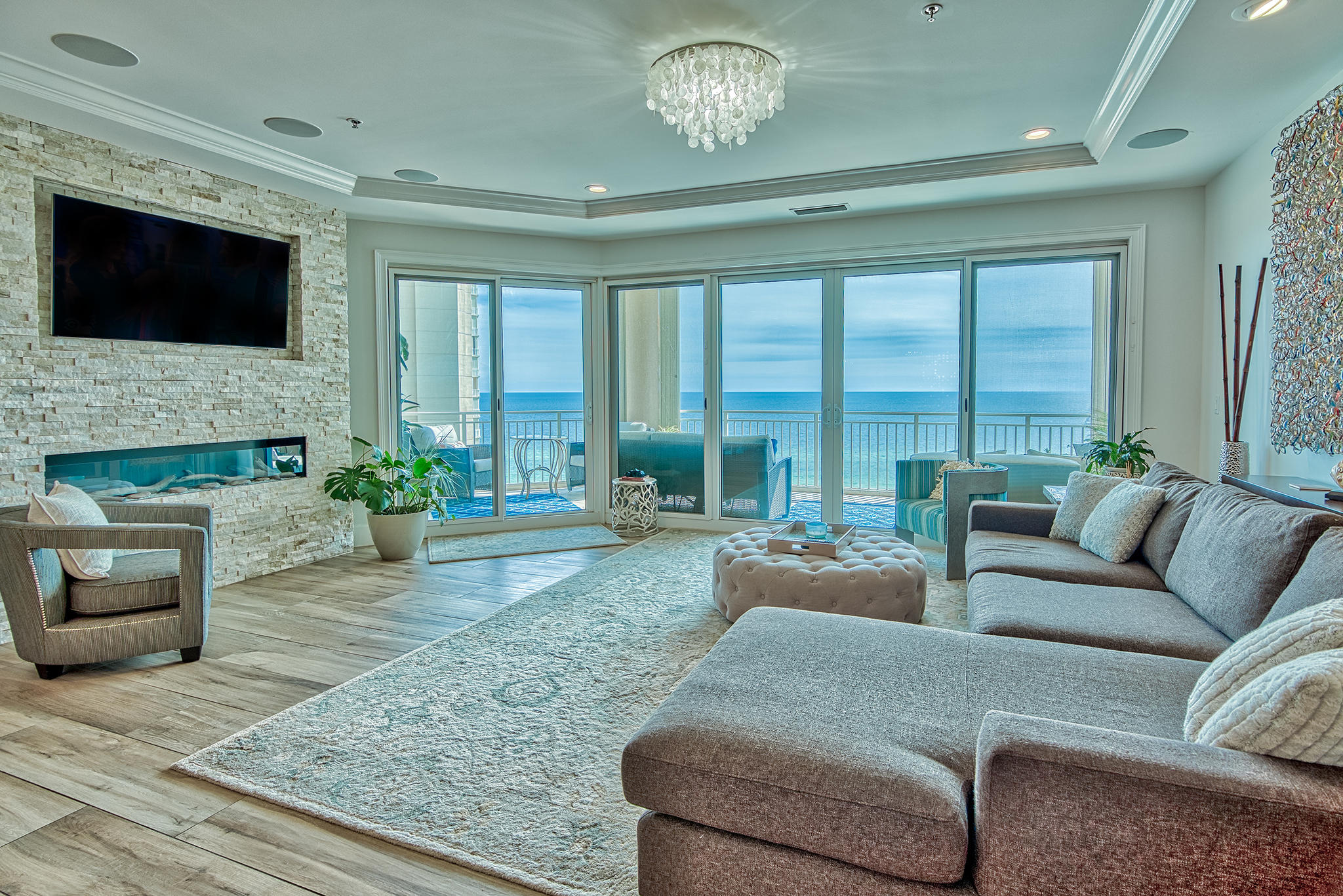 Phenomenal platinum level condo with panoramic views of the Gulf and Bay and exceptional one-of-a-kind custom updates throughout. This is the only 4-bedroom unit available for sale in the North Tower and has been completely updated with countless luxury features totaling over $350,000! Elegant features include oversized 12'' x 48'' wood plank tile floors throughout, Quartz & Vetrazzo countertops, tray ceiling & crown molding, recessed lighting in addition to stunning custom light fixtures, enhanced built-in sound system, dream kitchen with high end Wolf & Sub Zero appliances, custom backsplashes and unique decorative details, Marquis soft close custom cabinets, added custom bar for entertainment and the list goes on! Stunning Gulf views surround you with easy access to an expansive balcony