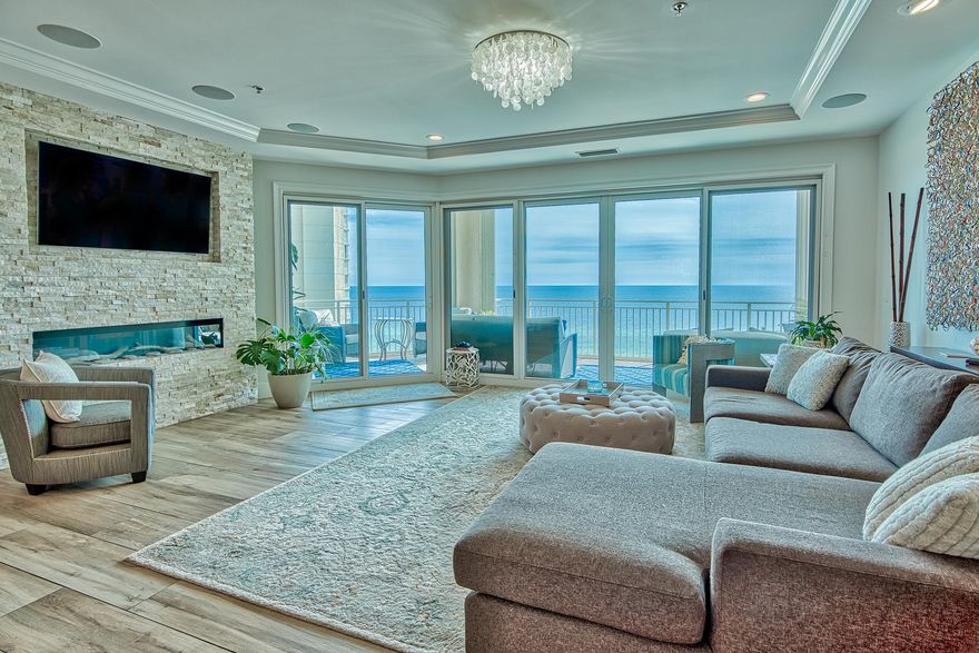 Phenomenal platinum level condo with panoramic views of the Gulf and Bay and exceptional one-of-a-kind custom updates throughout. This is the only 4-bedroom unit available for sale in the North Tower and has been completely updated with countless luxury features totaling over $350,000! Elegant features include oversized 12'' x 48'' wood plank tile floors throughout, Quartz & Vetrazzo countertops, tray ceiling & crown molding, recessed lighting in addition to stunning custom light fixtures, enhanced built-in sound system, dream kitchen with high end Wolf & Sub Zero appliances, custom backsplashes and unique decorative details, Marquis soft close custom cabinets, added custom bar for entertainment and the list goes on! Stunning Gulf views surround you with easy access to an expansive balcony