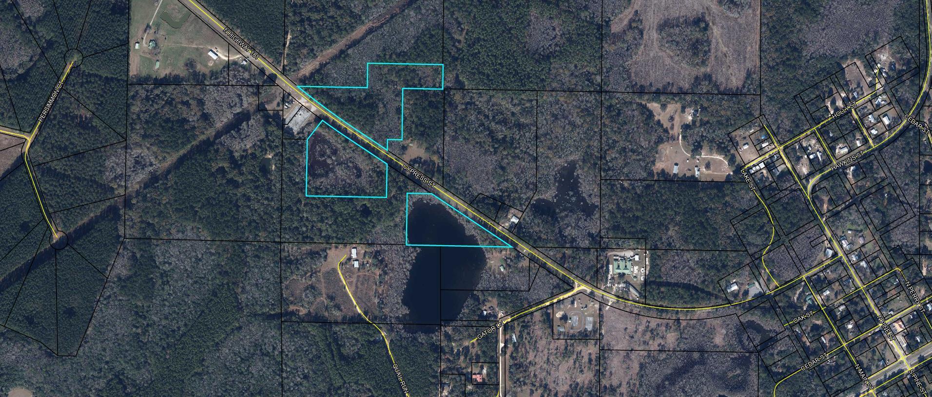 A remarkable piece of property that will allow you to live in a country setting and have plenty of room for hunting, fishing, or recreational activities. This property gives the buyer ownership of part Cooey Pond, a local fishing pond known for its freshwater fishing. Fill an ice chest and head right home to fry them up. The property consists of 3 parcels making the 21+ acres. Every parcel has paved road frontage. One parcel would be great for building and have a small pond. The other one would make a great hunting and recreational playground. The third has a large section of Cooey Pond on it. Come tak a look and let's get you settled before hunting season!!