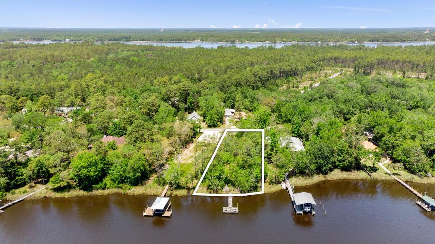 Bayou front lot just 5 miles from Santa Rosa Beach/foot of 331 bridge. Just 10 minutes to the beautiful beaches of South Walton. This waterfront lot comes with a boat dock that can be rebuilt. Quick access so the Bay out the deep water of Mallet Bayou. Over 1/2 of an acre offers privacy and serenity.
