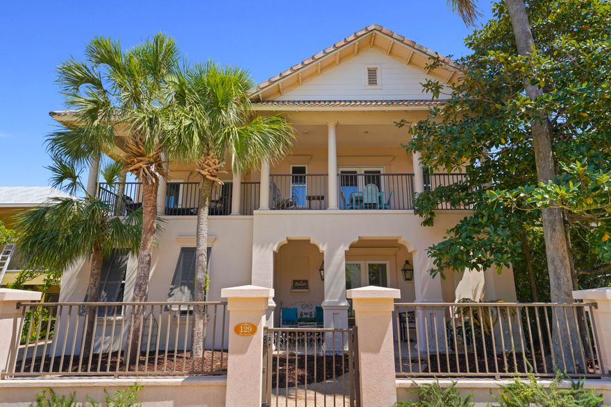 Nestled in the prominent Gulf-front, gated community of Caribe, this stunning custom home is an exceptional investment, primary or second-home opportunity. One of the few properties with a rare double-car garage, it also includes a storage room that can be converted into a rental carriage house. Inside, the open-concept first floor features a spacious kitchen with granite countertops, a breakfast bar, and a dining area illuminated by a rare Murano glass chandelier. A cozy breakfast nook, family room with a fireplace, built-in bookshelves, and a wet bar add to the home's charm. A versatile bedroom/office and full bath complete this level. Upstairs, the expansive master suite offers a jacuzzi tub, walk-in closet, and balcony access. A guest suite also opens to the balcony, along with an additional guest suite, a large bath with a soaking tub, and a cozy bunk area. 

The home is tastefully finished with natural sisal carpeting, tile flooring, and a signed Isamu Noguchi piece.

Outdoor living is just as inviting, with a full-width front balcony, a covered back patio, and a side patioperfect for relaxing or entertaining. 

Don't miss this unique opportunity to own in one of the Emerald Coast's most sought-after communities! Caribe boasts 500 feet of private beach, convenient beach walkovers, two pools (one heated), and a tennis court.

Property is sold unfurnished; however, a few select pieces of furniture may be included upon request or negotiation, chandelier in front will be changed out by chandelier sitting in the office.
