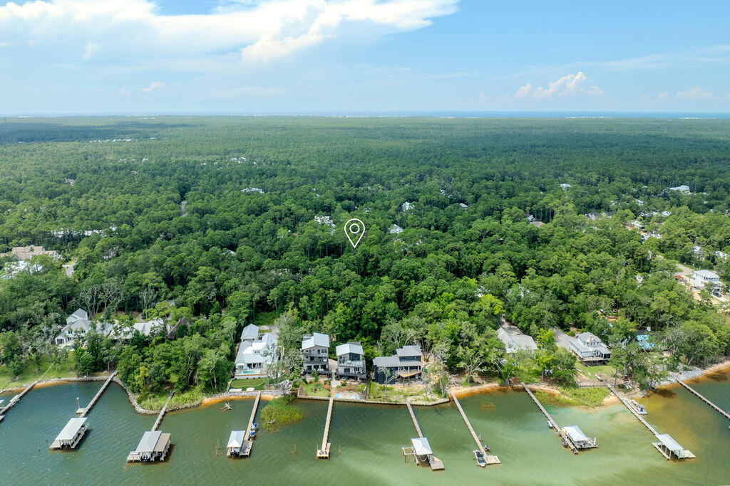 Located in Magnolia Beach within thriving Point Washington. Lots 13 & 14 present an incredible building opportunity, positioned within walking distance to the neighborhood Bay access and surrounded by towering trees. This peaceful setting is your blank canvas to live in the area's hottest region. Live the Bay life and have the beach at your fingertips.
