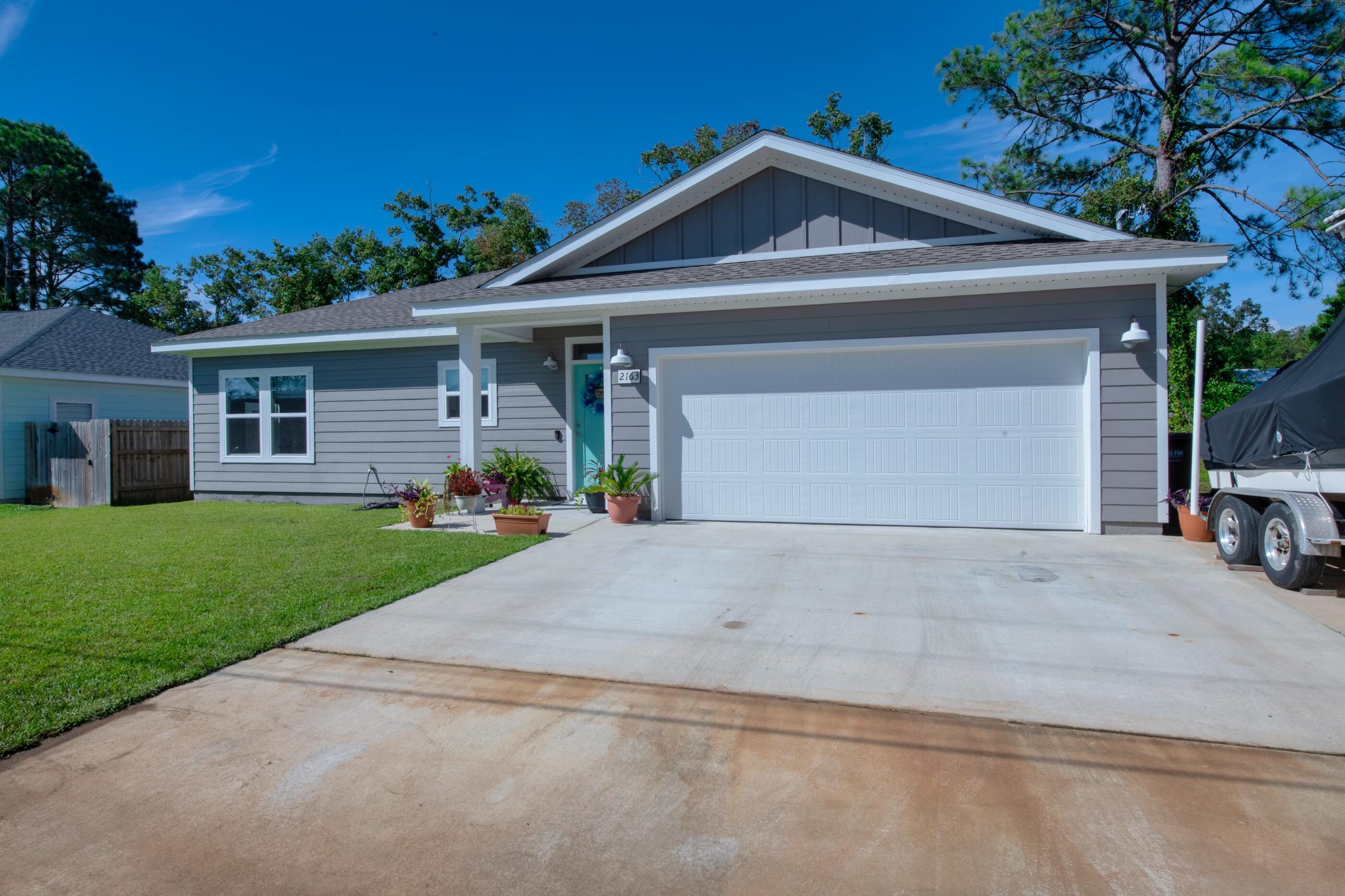 Beautiful home built in 2018. This split floor plan features plank wood-look tile flooring in the living areas and the carpet in the bedrooms were added for the perfect amount of warmth. The interior boasts Quartz counter tops, a walk-in closet in the master bathroom, a breakfast bar, Low E vinyl windows, and laundry room. On the exterior you'll find Hardy Board siding, a sprinkler system, fabric shield window protection, and additional boat or RV parking. The seller has a clean inspection report on the home, a survey that can be provided- saving you money on closing costs!