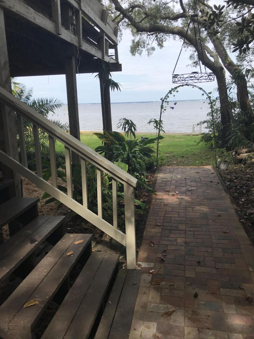 Rare to the Market, this ''Old Destin'' Bay-Front Lot/Home with 80 feet of beautiful emerald green deep water shoreline with seawall.  The 80' X 530' (.75 Acres) property is very ''private'' consisting of many incredible Oak Trees.  The Key West Style 2-Story Home built in 1987 on the property which is 2,670 SF with 4-Bedrooms & 3.5-Bathrooms.  The home has some really nice renovation features and upgrades already completed. There is also a detached garage. If your looking for a Bay Front home for a primary, 2nd or Rental look no further.  There is also a great opportunity to demo and build your dream water front home.