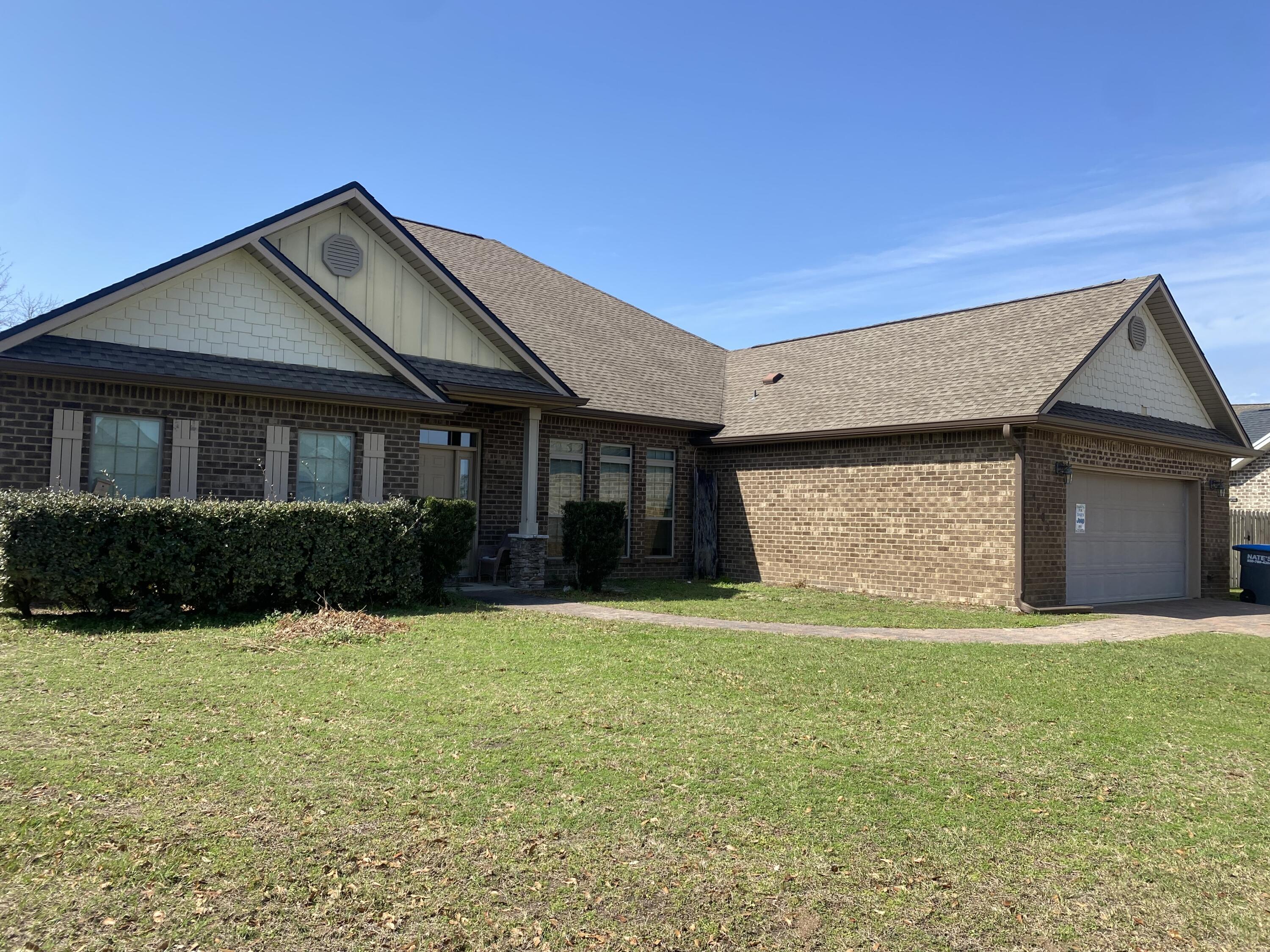 MOTIVATED SELLER! OFFERING ASSUMABLE VA LOAN AT 2.375!! CALL FOR DETAILS! Welcome to this spacious 5-bedroom, 3-bathroom all-brick home, offering over 2,800 square feet of single-story living space. (This is a true 4-bedroom plus office but currently the office is being used as a 5th bedroom.) This home has great bones, with a welcoming wide entry foyer that greets you with a view straight through to a covered back porch that runs the entire length of the home. The open-concept design seamlessly connects the family room and kitchen, with a long wrap-around bar, and is also open to dining room, creating a perfect flow for gatherings. The primary suite features a generously sized bedroom, and the primary bath has a garden tub, separate shower, linen closet, his & her walk-in closets, and private access to the back porch. This spacious family home gives you allall you are looking for, great options for indoor and outdoor entertaining. and special extras such as tray ceilings, pavered driveway, and more. Conveniently located just minutes from the mall, schools, Tyndall Air Force Base, hospitals, and shopping, this home offers both style and function. Don't miss out on this exceptional property! All measurements are approximate.