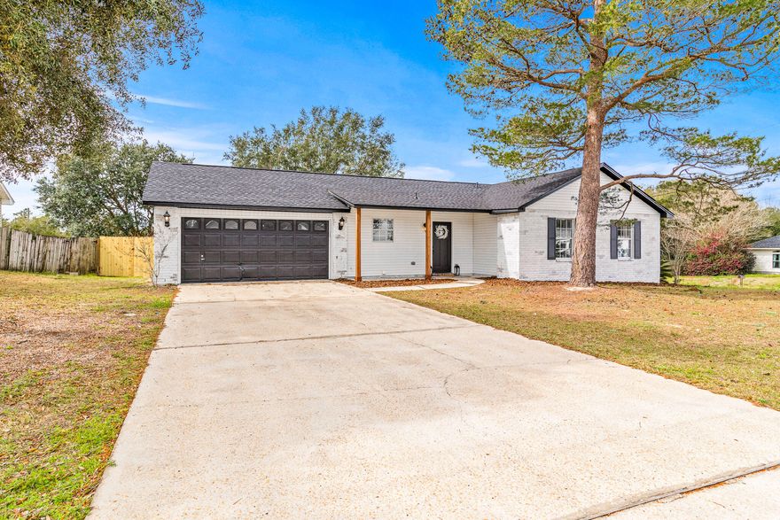 Welcome home. Charming 3 bedroom, 2 bathroom home located in desirable Navarre, FL. This recently updated house features stainless steel appliances, a dishwasher, fresh paint, and new light fixtures throughout. The property boasts a new roof, a spacious garage, tall ceilings, and a fenced-in yard for added privacy. Inside, you'll find walk-in closets, luxury vinyl plank flooring, and a convenient laundry room. Enjoy relaxing on the front porch or hosting gatherings on the back yard patio. With a storage shed and being situated on a corner lot, this home offers both functionality and style. Don't miss out on the opportunity to make this house your new home!