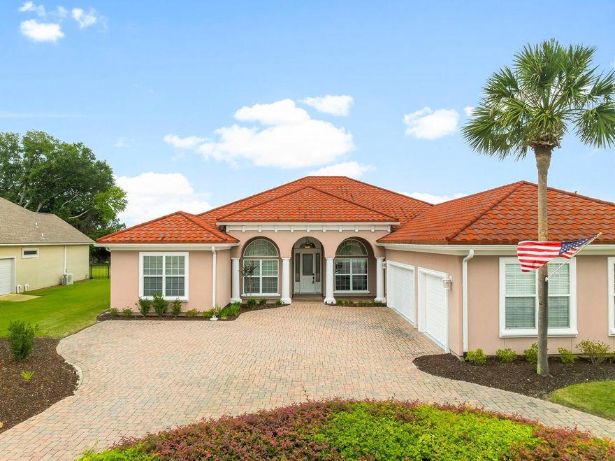 Relax with luxury living in a quiet gated neighborhood, yet just minutes to the worlds most beautiful beaches and great restaurants and shopping.   Your paradise awaits with this EPIC home located overlooking the 15th fairway of the acclaimed Jack Nicklaus golf course in the The Fairways gated community of Bay Point.  Outdoor living is an AMAZING feature of this home with a large screended-in pool and an incredible covered lanai complete with stone fireplace, making it ideal for those warm summer days or cool winter nights.  This 4 bedroom, 3 1/2-bathroom home  boasts 3130 square feet of living area featuring 13' ceilings, archways, columns and multi-layer crown molding.  Luxurious tile and Austrailian Cypress wood flooring adorn the home, making for a warm and upscale space. A split bedroom layout provides privacy and an separate office provides ample room as they flow into a large living space complete with a separate media room.  Incredibly well kept, this home exhibits many upgrades including new HVAC (2021) and many improvements since 2023, including: a COMPLETE pool refresh with a new coating, new tile, new pump-filter and piping; a fabulous 3-coat epoxy pool deck coating, new exterior paint, added gutters, new front door, new appliances and under-cabinet lighting, new faucets throughout the home, two full-bath remodels and an easily accessible new bathtub in the primary bathroom.  Plus many more upgrades.  The washer and dryer convey with the purchase.   The stone-coated steel roof is one of the best roofing systems made.  Imagine life in paradise.   You have found it here...HOME!