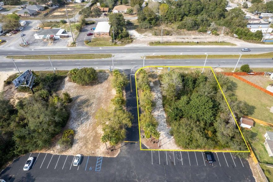 SELLER FINANCING AVAILABLE. LOT IS NOW CLEARED. Amazing lot with highway frontage located on Hwy 98 in Mary Esther, FL. This .43 acre lot is zoned R2 which has multiple residential options - single family, duplex, triplex, or possibly up to 6 multi-family units with approved plans and development order. Centrally located between Navarre and Ft. Walton Beach (less than 10 miles) means access to plenty of shops, restaurants, schools and businesses.