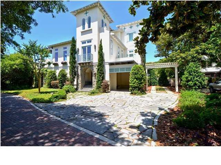 Looking to bring a little ''Dulce Vita'' in to your life? This luxury Custom-Built Villa is a little jewel of architecture straight out of an 18th century palazzo and located in historic Seagrove Beach on the corner of Scenic Hwy 30A and Live Oak adjacent to Seaside shopping, restaurants and events. The home ''Villa Fiore'' is located directly across from secluded Beach access with brilliant Gulf Views. The stunning stone arch and gas lights greets you at the entry of this superb Tuscan influenced home with the Mediterranean style garden and fountain. Unique white oak floors, a beautiful wood paneled elevator, a private secluded splash pool and Chagall inspired fountain that is an original design of water, lights and handcrafted glass tiles that waterfalls down from the second floo