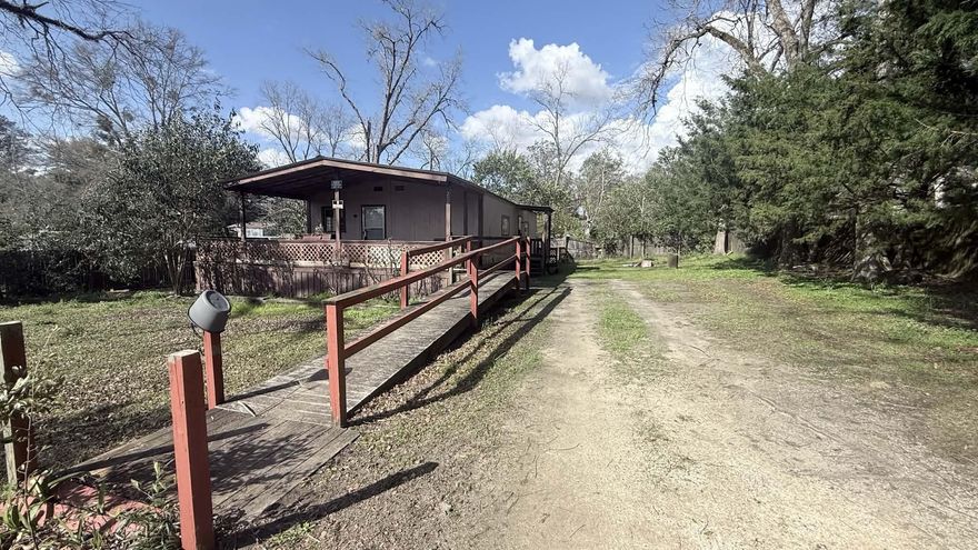 Investment opportunity located in Lockhart, AL. This 960 square foot modular building has been converted into a 2-bedroom, 2 bath home to include a kitchen and living room. Great location with a large lot and beautiful trees. Home is currently used as a rental. Great opportunity to invest your money and start building wealth in real estate. Location is convenient to Crestview Florida as well as Eglin AFB! Home has a large porch and ramp!