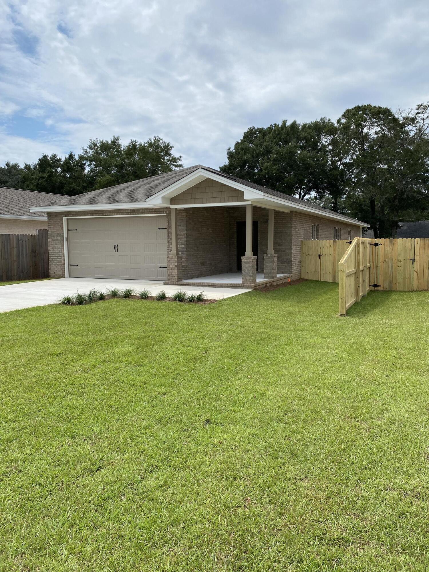 Brand new construction in Niceville! This 3-bedroom 2 bath house is 1,960 square feet located on a tree lined street and just a hop, skip and a jump to Bluewater Bay Elementary. Interior features of this home include LVP flooring throughout (except for two of the bedrooms which are carpeted), center island, stainless steel appliances, white cabinets, granite countertops, tile backsplash, walk-in pantry, and large laundry room. Two bedrooms and bath are located in the front of the house with the master bedroom in the back for maximum privacy. Very spacious fully fenced backyard with irrigation and room for a pool. Conveniently located to Eglin Air Force Base, and a short drive over the Mid-Bay bridge to the beaches of Destin.