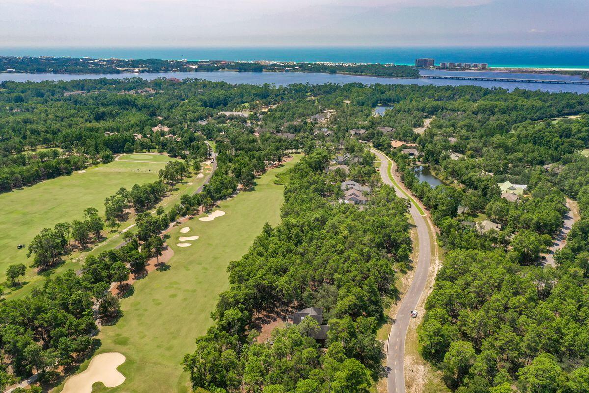 Premium corner lot in the beautiful gated community of Wild Heron, a 734-acre Coastal Sanctuary, located on the shores of Lake Powell, Florida's largest coastal dune lake. Located near the front of Wild Heron, this .58 acre lot is one of few Type A lots available in the community and backs to a protected conservation area with a buffer located to the left of the lot for added privacy. Come and experience the world class amenities that this lake front coastal craftsman community has to offer, including a fitness center, pool and hot tub, boat house for storing kayaks and paddle boards, community dock, fire pit and gathering area with fireplace all overlooking Lake Powell.