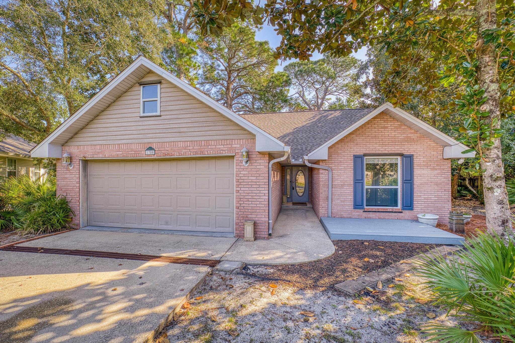 Bright, sunny house with access to the Sound! Nestled under a canopy of mature trees, this comfortable 3-2-2 home is situated on a quiet cul-de-sac on nearly 1/3 acre, boasting a serene, lush landscape and a delightful sunroom overlooking the vast surroundings out back. The sellers added a rock river to the front yard, complementing nature's bounty. The home boasts all hard surface floors and an abundance of storage space. With a 3 year old roof and a brand new AC unit, the foundation for your dream home is already in place. Bring your vision to life and make this house truly your own. Not only is this property a rare find for nature lovers and water enthusiasts alike, the neighborhood embraces newcomers and there will be many opportunities to meet them at HOA barbeques or on daily walks!