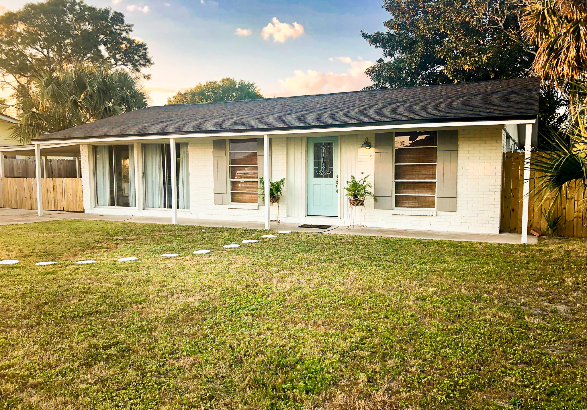 This charming 4 bedroom ranch is located just a few blocks off the Gulf in the popular Open Sands neighborhood. You can enjoy ocean breezes from the covered patio, or a game of catch, or cornhole with the family in your large fenced-in backyard...there is even room for a pool!You'll notice fresh paint inside and out in modern coastal colors, a new roof and fencing. Interior features include bamboo flooring, updated appliances and lighting, and vaulted ceilings create a spacious feel throughout all the main living areas. The 4th bedroom located off the kitchen makes a great bonus room or guest bedroom, and it has its own full bath and separate entrance! The home comes with a small shed off the patio perfect for all of your beach gear, and a large 10'x24' storage building offering ample