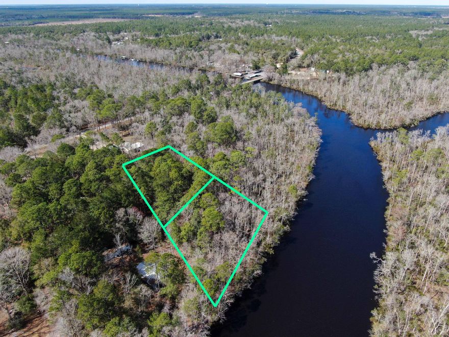 INCREDIBLE WATERFRONT OPPORTUNITY! Zoned GENERAL COMMERCIAL! Live along majestic Black Creek or build your waterfront business. Amazing location in unincorporated Freeport, east of 331! Unlike many waterways in the area, Black Creek is both navigable for large boats and yet very peaceful without major boat traffic. Build your country retreat or business and waterfront dock only 25 minutes from 30A. Listing price is for 2 lots of record that are 1 acre each! Build on one acre and sell the other, or create a private compound or business. No HOA -- and public water-sewer just landed in this section of Highway 3280!These parcels are close to what is major portions of Walton County's largest area of private conservation easement lands along Black Creek known as Nokuse conservation lands.