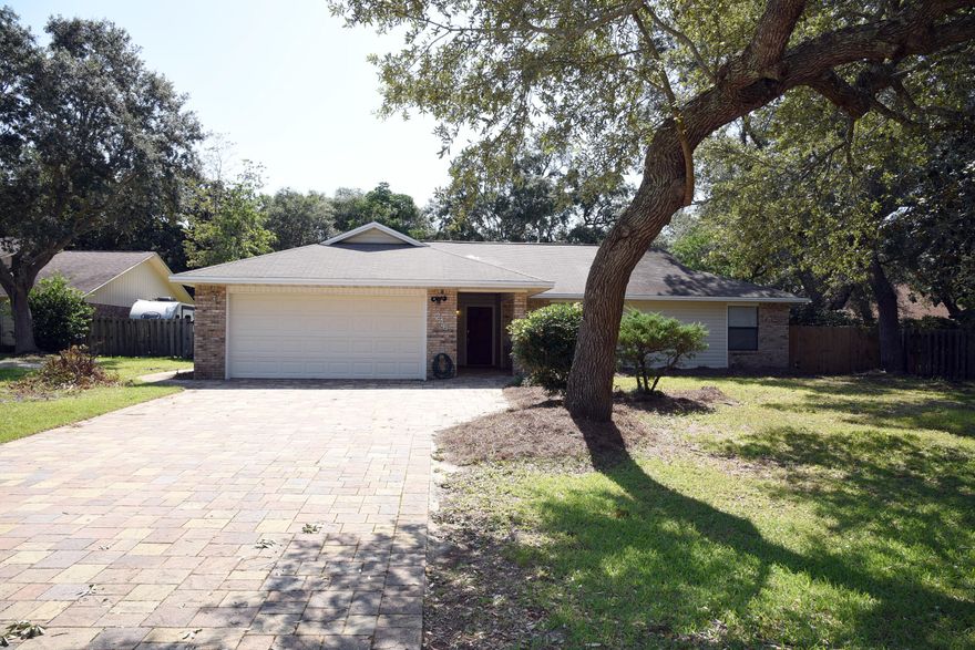 Don't miss the opportunity to add your own touches to this 3 bedroom, 2 bath home in a nice neighborhood zoned to Bluewater Elementary School. The wood burning fireplace is the focal point of the great room.  An eat-in kitchen with lots of wood cabinets adjoins the dining area with a wet bar. The master bedroom and both additional bedrooms are quite large. Enjoy the Florida room with terra cotta tile floors, an open patio and fully fenced backyard.  Make your appointment to see this home today!