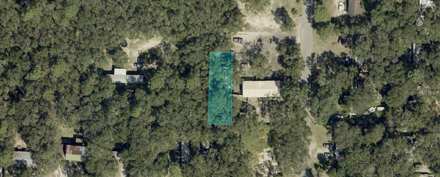 Beautiful wooded .10 acre lot zoned R1M.