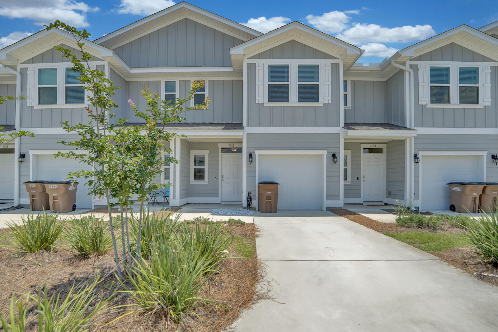 PRICED TO SELL, this amazing 3-bedroom townhome that allows short term rental and just a few minutes' drive to the beach. This townhome is in immaculate condition, only owned by one owner who bought it when it was first built in 2020. The interior features carpets in all three bedroom and the stairs, luxury vinyl plank flooring throughout the living space and bathrooms, granite counter tops with a breakfast bar area, smart home technology, stainless steel appliances, recessed lighting, washer and dryer hookups.