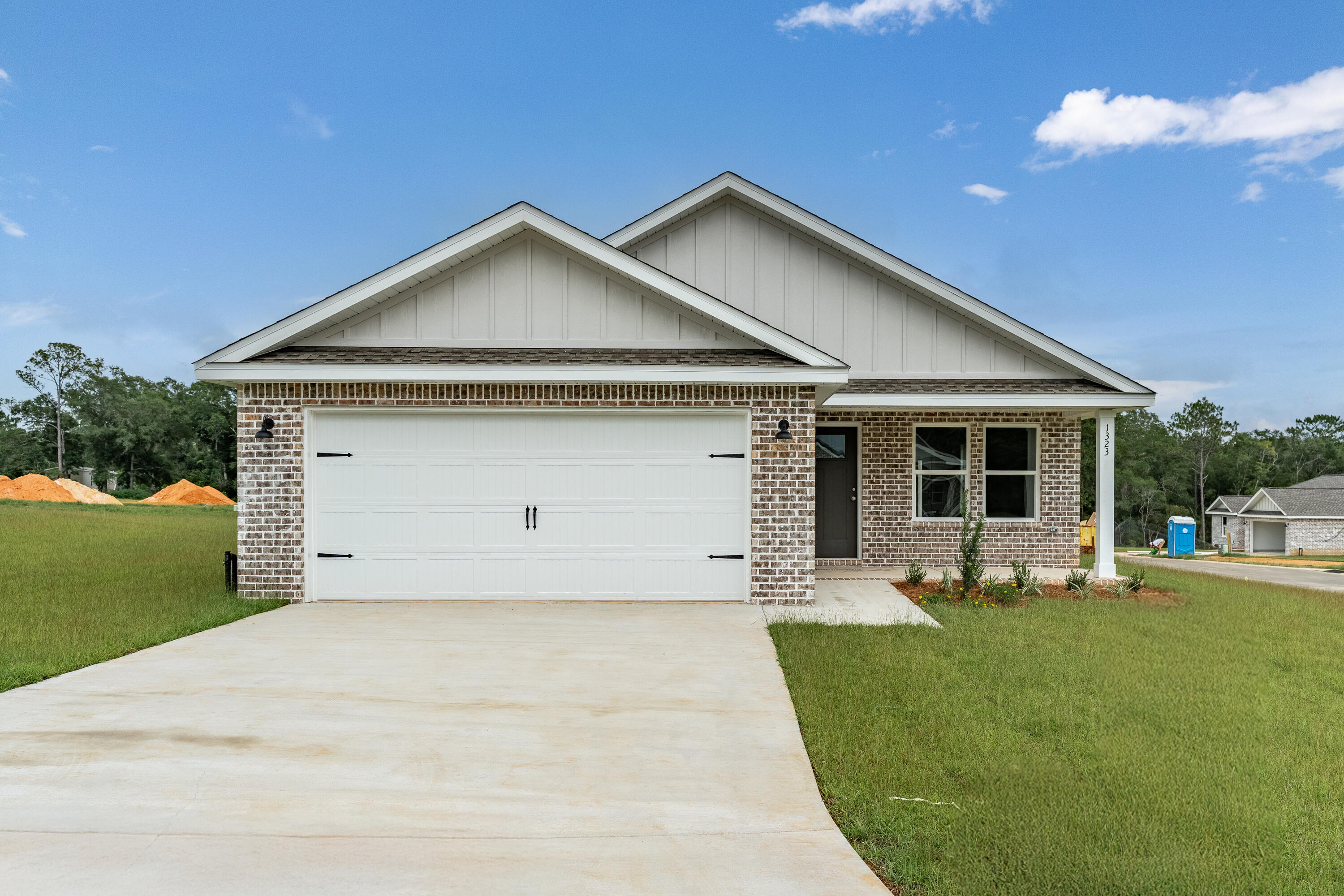 $15,000 ANYWAY MONEY FOR CLOSING COSTS/PREPAIDS/RATE BUYDOWN OR EXTRA APPLIANCES -''FRANKLIN'' FLOOR PLAN will be ready in late July - Welcome to SOUTHERN DAY CHATEAU S/D IN BAKER FLORIDA! This all-brick home features raised ceilings, recessed lighting, ceiling fans thru-out, luxury vinyl plank flooring, granite or quartz countertops, sprinkler system for the beautiful, landscaped yard. Front and rear porches for relaxing. Kitchen has white shaker style cabinets, work island w/bar seating, cozy dining area, pantry and stainless-steel appliances. Owner's bath has walk-in closet, double vanities, shower only. Photo of similar completed home, interior/exterior colors will vary, front elevation may vary.