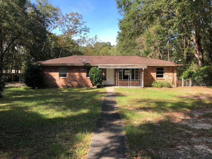 Fabulous brick home with a new Kitchen cabinets and Counter tops installed today! Hard wood floors installed this year with open floor plan with a fenced front yard in a private secluded setting. Also 2 sheds and a storm shelter with a kitchen, bedroom and living space.