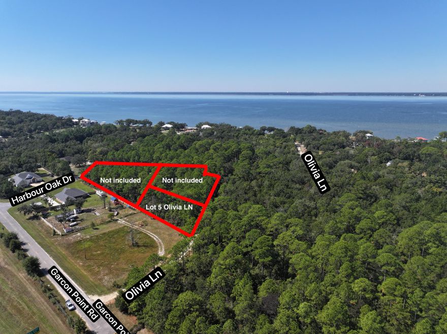 Bring your plans to life on this half-acre homesite within the established Harbour Oaks community. This property offers a comfortable footprint for a custom build, surrounded by mature trees and quality neighboring homes. The setting provides a balance of privacy and accessibility, making it a smart choice for future development or long-term investment.Buyer to verify all measurements, acreage, access, and any utility availability or road maintenance details during due diligence.