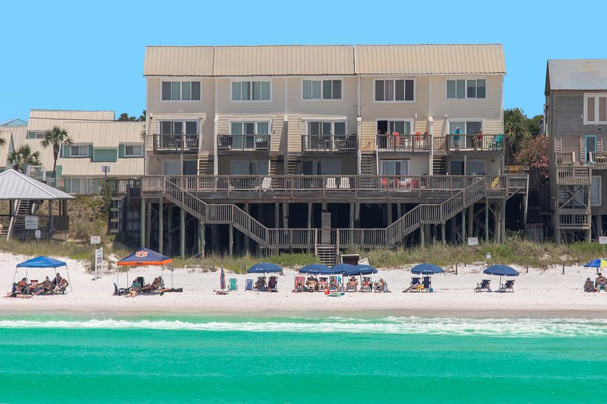 This three bedroom three and a half bath beach home delivers stunning Gulf views fromalmost every room. The layout of Summer Haven 4 has a split floor design with individualguest quarters on the first and third floors with the main living area and kitchen in between onthe second floor.  The entire first floor encompasses a dedicated beachfront guest quarters.The master bedroom is on the third floor. Balconies on the first and second floors lead to stairs down to your private beach. Situated right on the water, you simply can't get any closer to the Gulf. Loungeon your balcony and enjoy incredible sunrises and sunsets. This is  what Gulf front living is trulyall about. Close to Sandestin Resort, the Village of Baytowne Wharf, Grand Boulevard and other