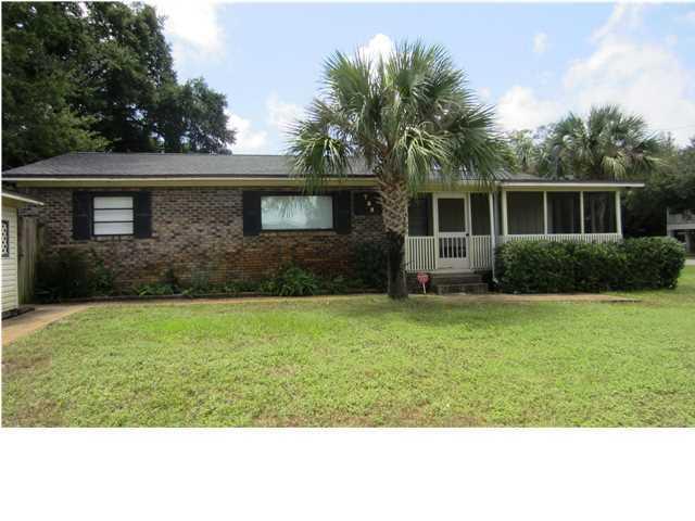 A rare find! Must see to appreciate! Large corner lot, home sits 100 yards from Joe's Bayou boat ramp and Mattie Kelly Park and Nature Walk. This all brick home was remodeled in 2006 with Japanese Cherry wood laminate flooring, tile in kitchen and baths, new sheet rock walls with Spanish lace finish. This split bedroom floor plan has updated electric and plumbing, large screened front porch, detached garage, sprinkler system, and gazebo in back yard.