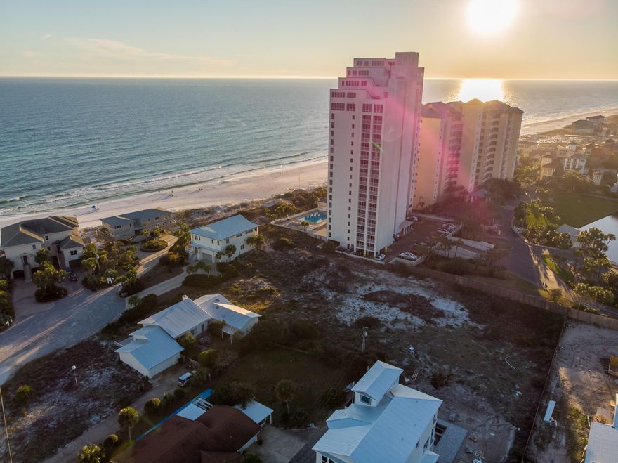 This coveted Gulf Pines neighborhood is perhaps one of the last locations depicting an Old Florida ambiance in this area - Lot 21A offers a spectacular home site, at a very competitive price, that will allow beautiful Gulf of Mexico views - only a few lots from the water. A very short walk to the beach, or hop in a golf cart, as golf cart parking is available at beach entrance. Also unique, this neighborhood has no homeowners fees, a rare find, only a voluntary annual $300 fee to maintain the private, deeded beach access.Build a permanent residence or a vacation rental. Owners enjoy a large pavilion and beautiful beach sunsets. There is a lake in the neighborhood, too, that is stocked with fish. The beach at Gulf Pines is so spacious with approximately 1,300 feet of breathtaking gulf-front, sparsely used in this low density neighborhood, truly a paradise. Bounded on the east side by Sandestin and on west side by Hidden Dunes; a convenient location so close to all shopping, dining, golf courses - all the amenities people come to Destin to brag about