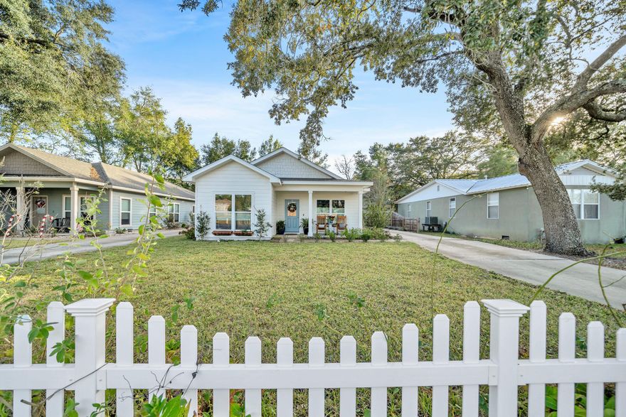 Live in the heart of Niceville in this adorable craftsman style home that is better than new! The open floorplan features a large living room open to the dining area and kitchen. The kitchen offers a large island with a built-in breakfast bar, a large pantry, soft close cabinets and quartz counter tops. This is a split bedroom home with two of the bedrooms and a full bath in the front of the house and the master suite in the back. The oversized master bedroom includes a sitting area and the master bath features a tiled shower and double vanities.  A convenient breezeway connects the house to the oversized 2-car garage. The tidy back yard has a sprinkler system and there is extra parking at the end of the driveway. Additional noteworthy features include: underground utilities, Hardie