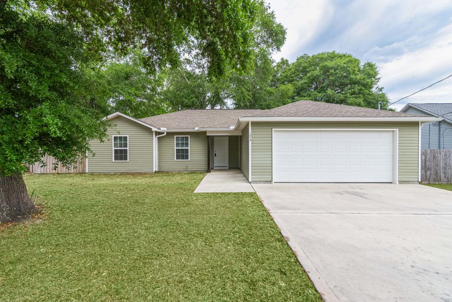 This beautiful open concept home is like BRAND NEW! The gorgeous contemporary design features vinyl plank barn wood flooring throughout the entire home. The upgraded luxury granite counter tops are a feature you would expect to find in a home 3X's the value of this one. With the shaker style white cabinets the granite just looks that much richer. Another wonderful upgrade is the contemporary lighting including a chandelier in the master bathroom. The 4/2 floor plan provides plenty of room for living. A 2 car garage, privacy fenced back yard, large laundry room and covered front porch round out this beauty. Call today!
