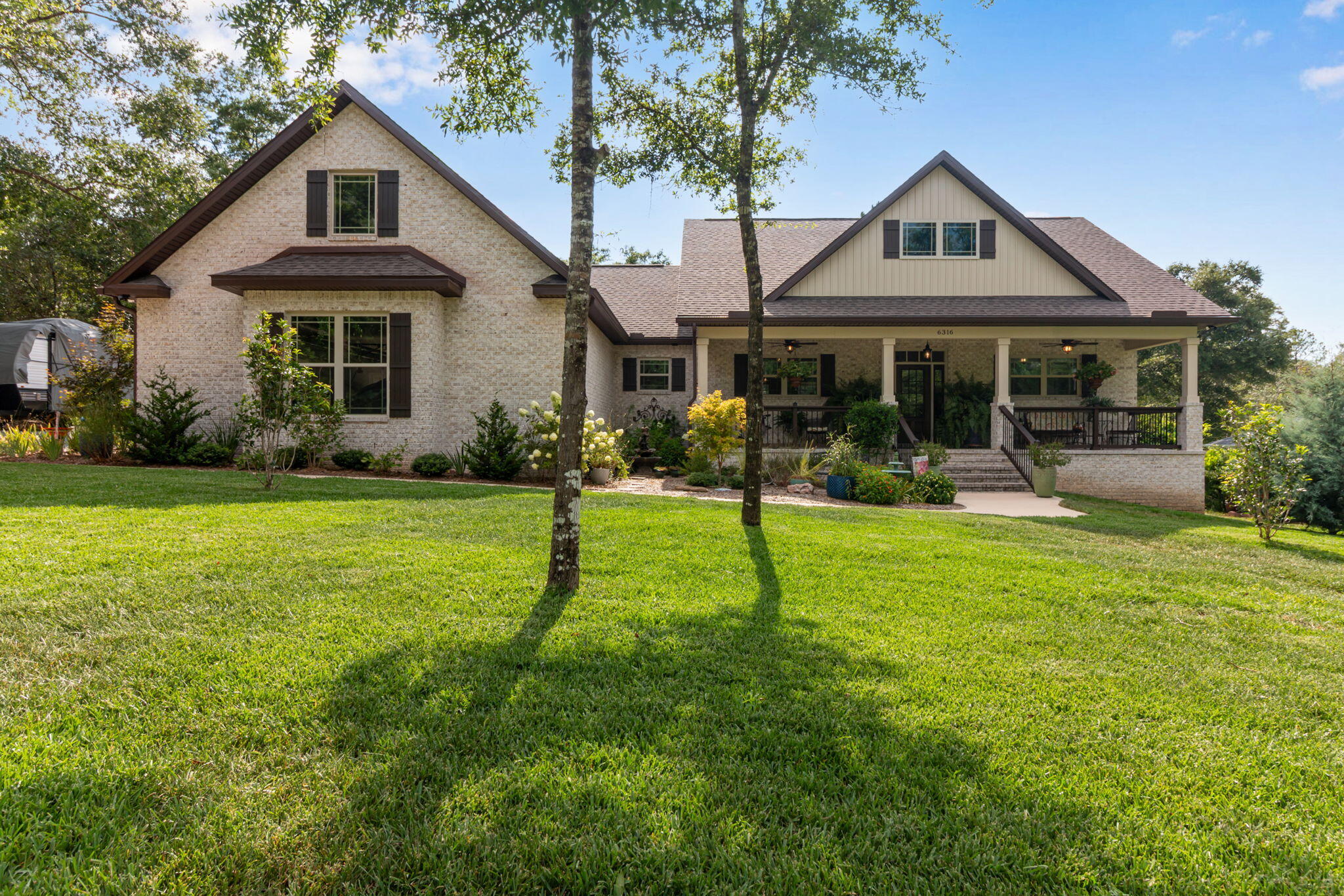 Custom-built and like new, this stunning home in North Crestview offers all the upgrades and charm you've been looking for. The spacious open-concept layout is filled with natural light from ample windows and features wood-beamed ceilings and durable LVP flooring throughout. Enjoy cozy evenings by the wood-burning fireplace, meals in the oversized dining area, and cooking in a dream kitchen with a large island, granite countertops, stylish lighting, stainless steel appliances, and a walk-in pantry. The laundry room adds functionality with ample counter space. Outdoors, relax on the screened-in patio or entertain on the deck with a pergola over the above-ground pool. A large workshop, greenhouse, and raised garden beds complete this beautiful property, all situated on just over an acre.