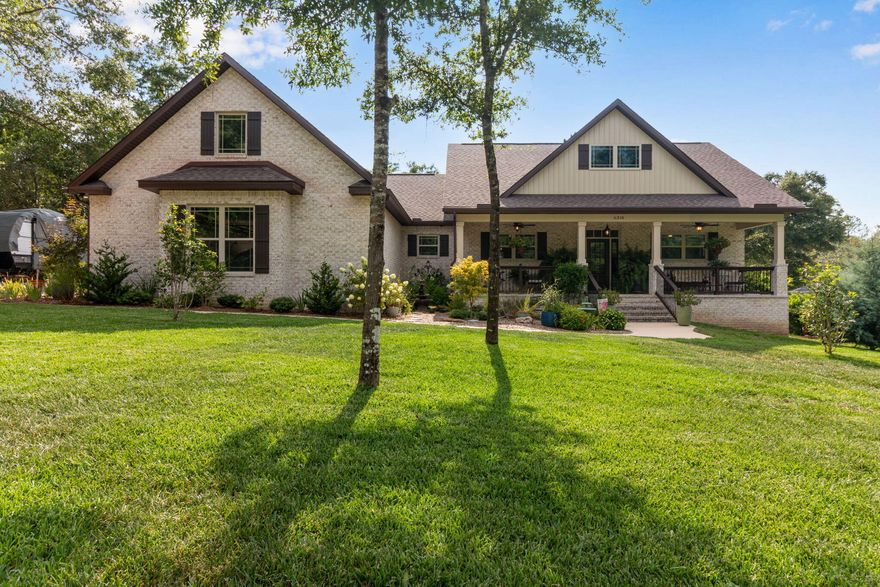 Custom-built and like new, this stunning home in North Crestview offers all the upgrades and charm you've been looking for. The spacious open-concept layout is filled with natural light from ample windows and features wood-beamed ceilings and durable LVP flooring throughout. Enjoy cozy evenings by the wood-burning fireplace, meals in the oversized dining area, and cooking in a dream kitchen with a large island, granite countertops, stylish lighting, stainless steel appliances, and a walk-in pantry. The laundry room adds functionality with ample counter space. Outdoors, relax on the screened-in patio or entertain on the deck with a pergola over the above-ground pool. A large workshop, greenhouse, and raised garden beds complete this beautiful property, all situated on just over an acre.