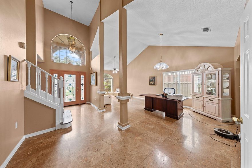 Step into this beautifully upgraded 4-bedroom, 3-bath home featuring an open-concept layout with soaring cathedral ceilings, travertine marble floors, and a downstairs guest suite. The chef's kitchen boasts solid wood cabinetry and overlooks the inviting living and dining areas, perfect for entertaining.Relax in the private backyard oasis complete with a screened lanai and sparkling pool. The luxurious primary suite offers a large soaking tub and plenty of space to unwind.Nestled in a peaceful, walkable community just minutes from the water, this home is ideally located only 5 minutes from Eglin AFB's main gate and just 3 minutes from the area's premier marina with boat dry storage. Whether you're into boating, biking, or simply enjoying the Florida lifestyle!