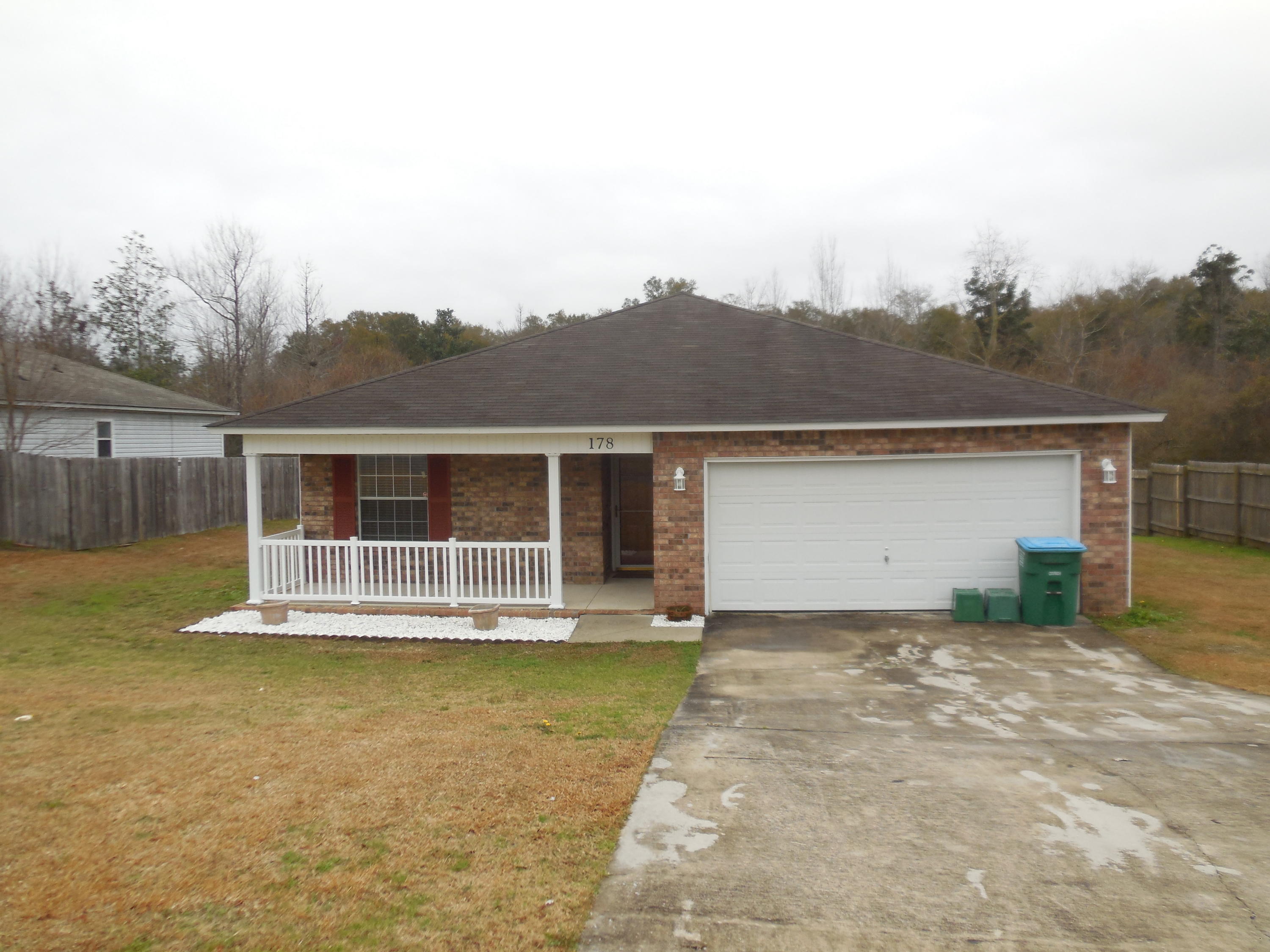 DON'T MISS THIS 4/2/2, brick-front,1284sf home!! This home features a wonderful covered front porch, the popular split bedroom design, open family/dining & kitchen & deck overlooking woods to the back. Also, ceiling fans in all bedrooms & family room, garage door opener, , storm door, , large walk-in closet in master. All appliances to include smooth-top stove, new microwave, dishwasher, newer refrigerator & full-size WASHER & DRYER (AS-IS)!!! AND MORE!!! Newer laminate Flooring - carpet only in bedrooms!! Call today to make your appointment!! NO PETS-NON-SMOKERS ONLY. Showings M-F, 9-3PM, by advance appointment!!