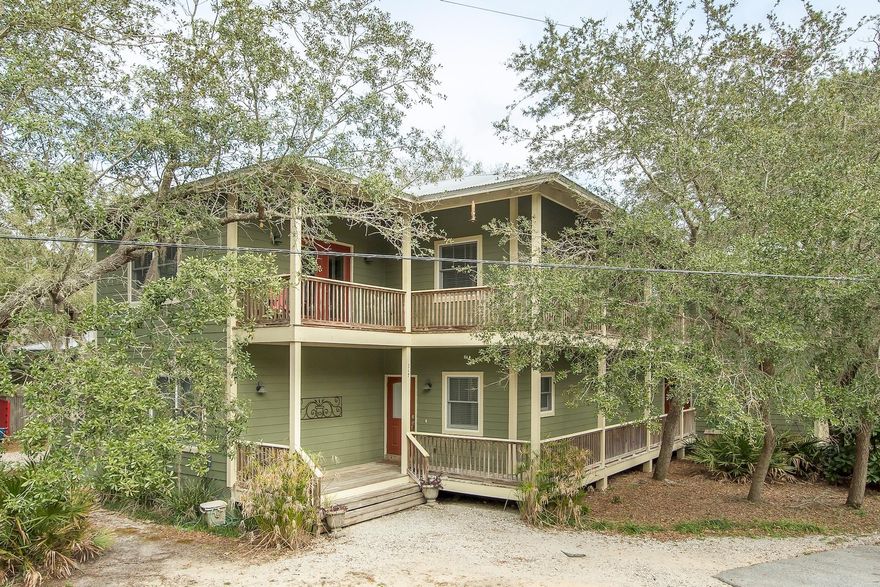 Incredible opportunity to own a fantastic 3-bedroom, 3-bath home surrounded by nature close to the Bay! This property is nestled on a beautiful corner lot that is over a quarter acre and a serene setting with mature live oak trees and natural surroundings. The home encompasses plentiful outdoor spaces including a wraparound porch, balcony & amazing new open air, upper level deck perfect for entertaining, outdoor dining or simply relaxing with a good book. Just past the deck is an additional bonus area great for an office, art studio or lounge. Ideally there is plenty of storage throughout the home along with a 3-car garage. From the upper deck, you have direct access into the kitchen, wet bar and living & dining area - making entertaining easy. Start enjoying that coastal lifestyle today!