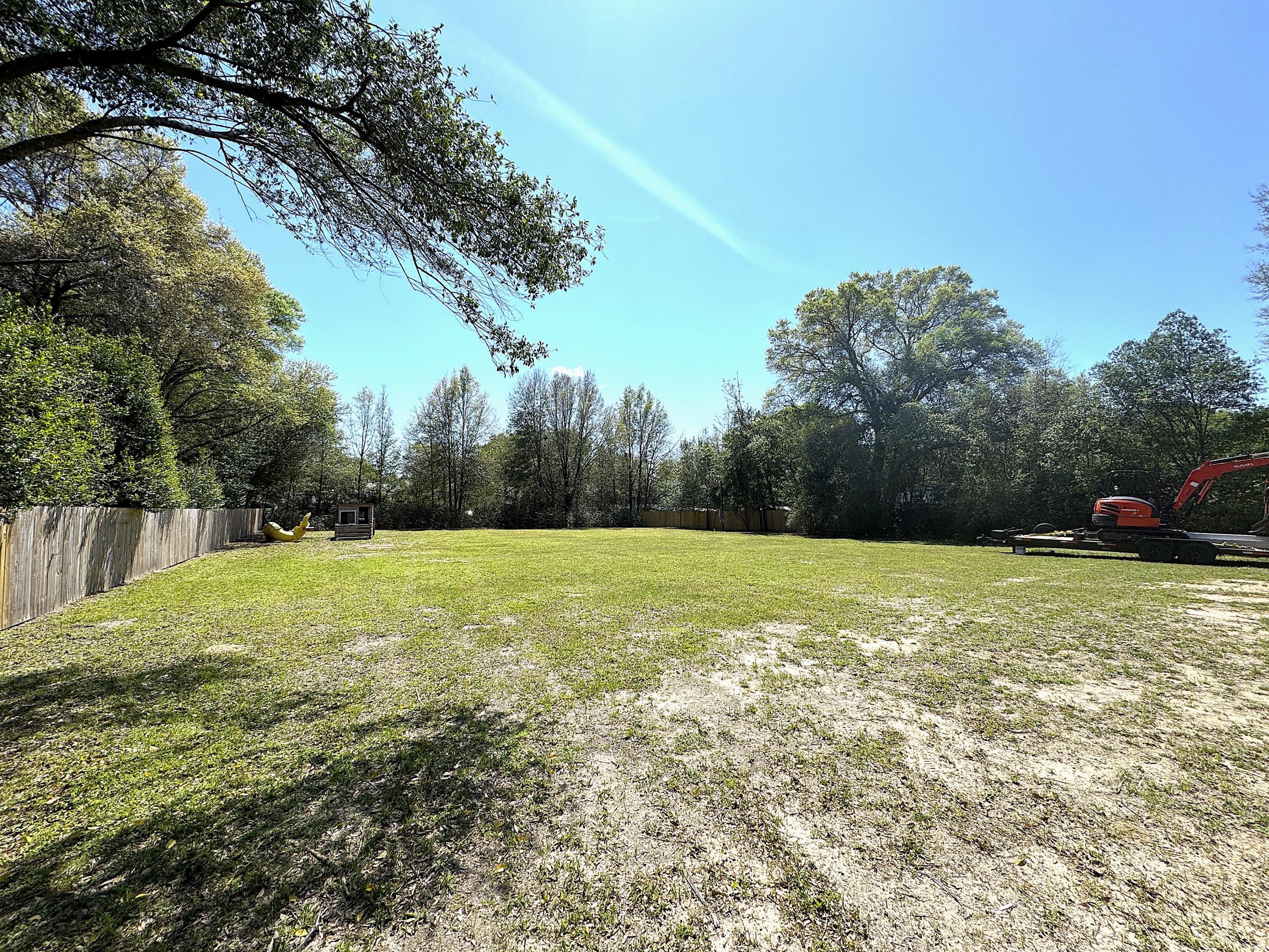 Private & flat residential lot perfect for a new home or mobile home in NON HOA neighborhood. Water, power and septic are already on site. The lot is completely fenced in with azalea bushes on the south lot line. Easy access to Crestview, Walker Elementary School, Crestview Airport and a stones throw from Hwy 85/Hwy 90 intersection.