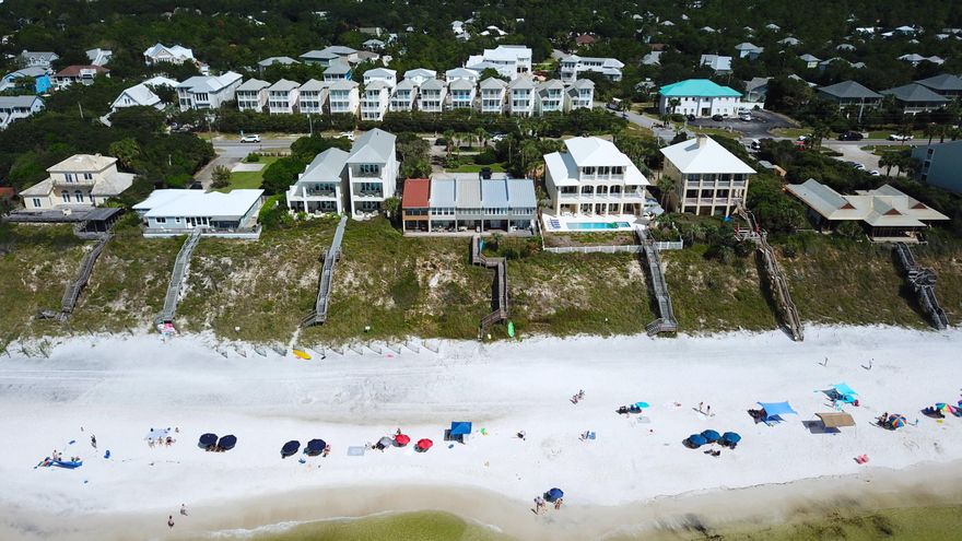 This gulf-front townhome takes you back to simpler days with the feeling of a quaint beach cottage in a five-unit complex in Inlet Beach. Featuring three beds, three baths and 1,578 square feet of living space, this townhome makes a great vacation home or rental opportunity in an ideal location near Alys and Rosemary Beach, Highway 98, Camp Creek Lake and the nearly 19-mile Timpoochee Trail, which is perfect for biking between beach communities along Scenic Highway 30A.  The first floor of this townhome features tile flooring throughout and includes connected kitchen, dining and living room spaces with views of the Gulf of Mexico, as well as one bedroom with bath and access to a covered patio. The second floor is carpeted and hosts an owner's suite with gulf-front sitting area and a third bedroom with en suite bath.