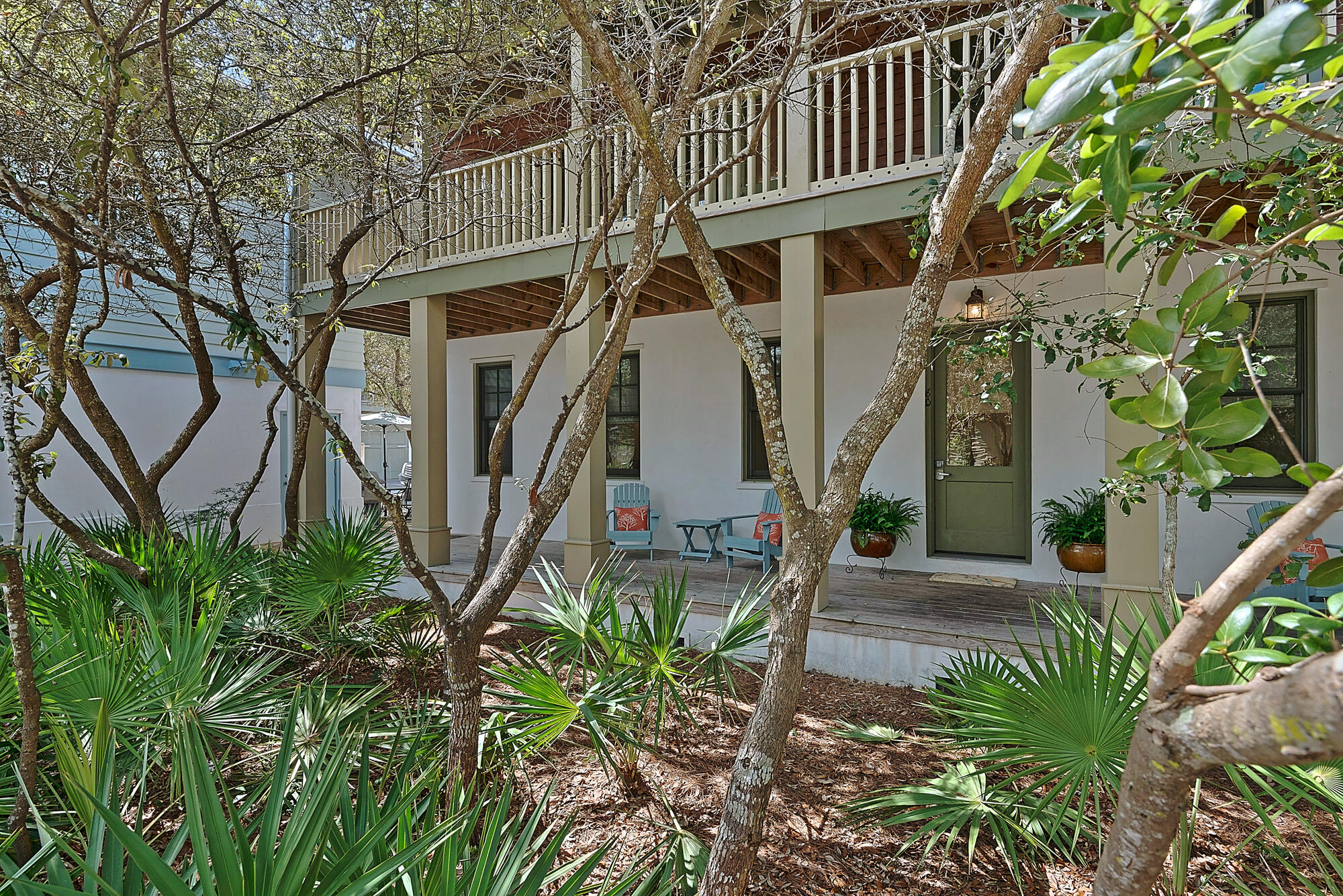 Discover the charm of Rosemary Beach in this enchanting cottage and carriage house. Perfectly situated on a desirable corner lot, this home provides easy access to the Eastern Green, the stunning turquoise blue water of the Gulf of Mexico, the refreshing Coquina Pool, tennis courts, and the vibrant town center brimming with shops and restaurants. Vacation renters rave about the fabulous location and the inviting atmosphere. Over $212K rental revenue 2023.The main cottage exudes a cozy, treehouse feel with its large wraparound upstairs porch, nestled amidst the trees. Inside, all three beautifully appointed bedrooms, each with its own ensuite bath, are located on the first floor, ensuring privacy and comfort. Ascend to the second floor to find a bright, airy living space where the