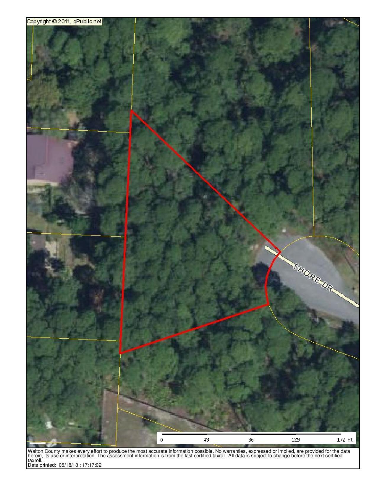 Wooded lot across street from the bay.