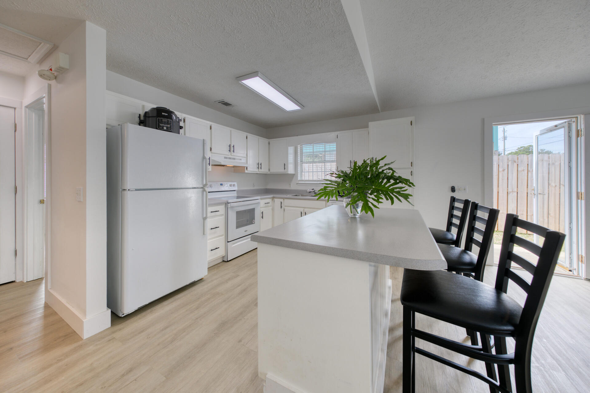 Great opportunity on the sought after west end of Panama City Beach. This recently updated 2 bedroom 2 bathroom home has all new flooring, lighting, ceiling fans, interior/exterior paint and updated bathrooms. The large fully fenced yard will accommodate a future pool/summer kitchen or home garden. Make this your vacation getaway or short term rental property. It's a must see to appreciate. Home lot size is approximately 50x100. Survey to be provided to buyer at closing.