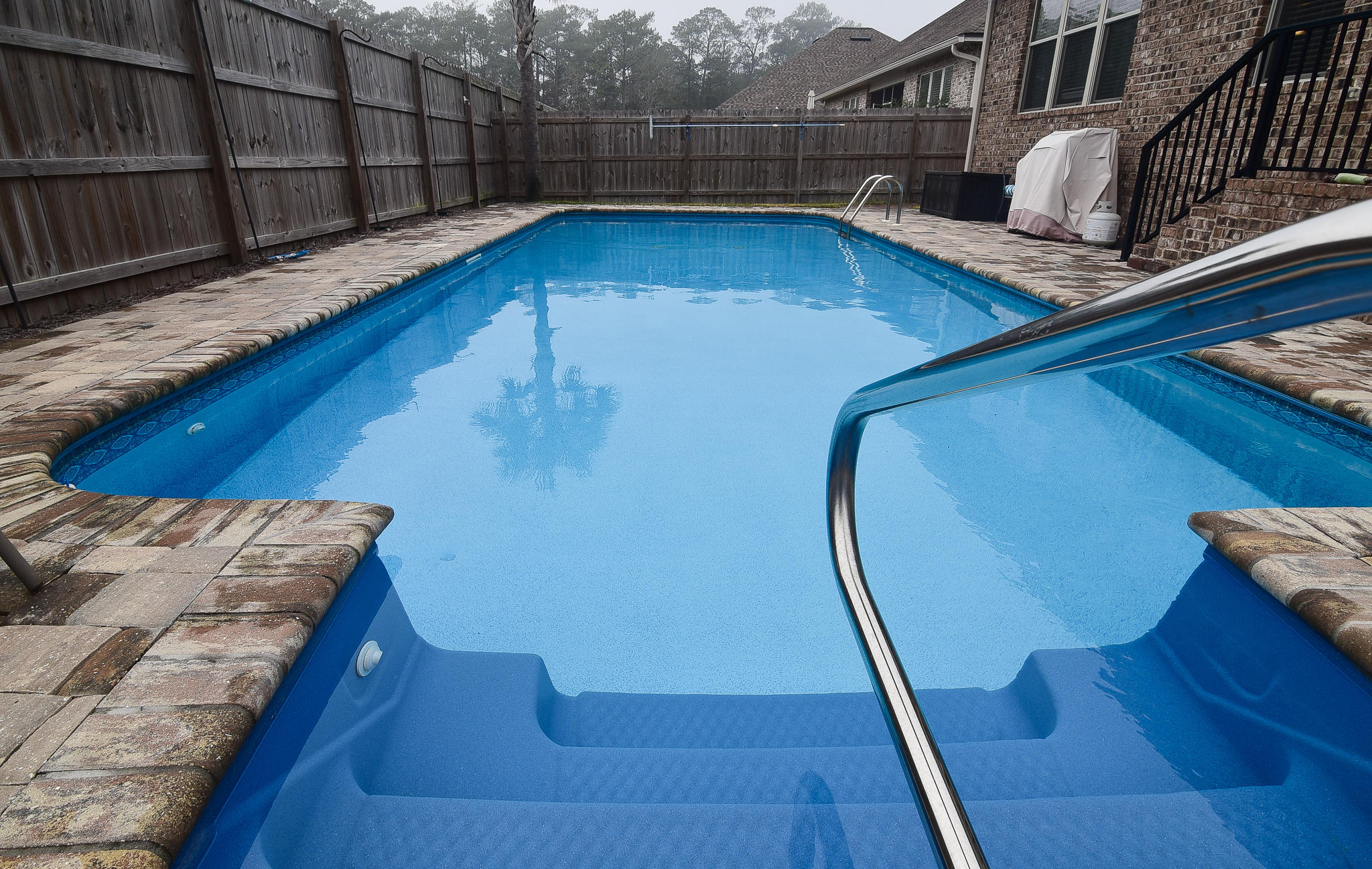 All brick gorgeous home built in 2016 in the desirable Magnolia Woods neighborhood in Niceville. An open floor plan all on one level includes 4 bedrooms and 3 full bathrooms, multiple living areas and a backyard oasis WITH A POOL, perfect for the hot Florida summers. Notable features include high ceilings, recessed lighting, crown molding, an oversized island with breakfast bar, glass front cabinets, updated appliances including a gas range and french door refrigerator, walk in closets, frameless tiled showers, and built in desk area. Home is tenant occupied - Showings begin TUESDAY 3/3 and you Must have a confirmed appointment. Washer and Dryer to not convey.