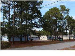 Amazing Opportunity for great cash flow on 9 duplexes in Navarre! 10 units rented and with addition of sewer or septic and minor repairs all units will be rented! Nine duplexes on five parcels of real estate. Includes 2151 Panhandle Trail Units A-H, 2175 Panhandle Trail Units A & B, and 2201 Panhandle Trail Units A-H.