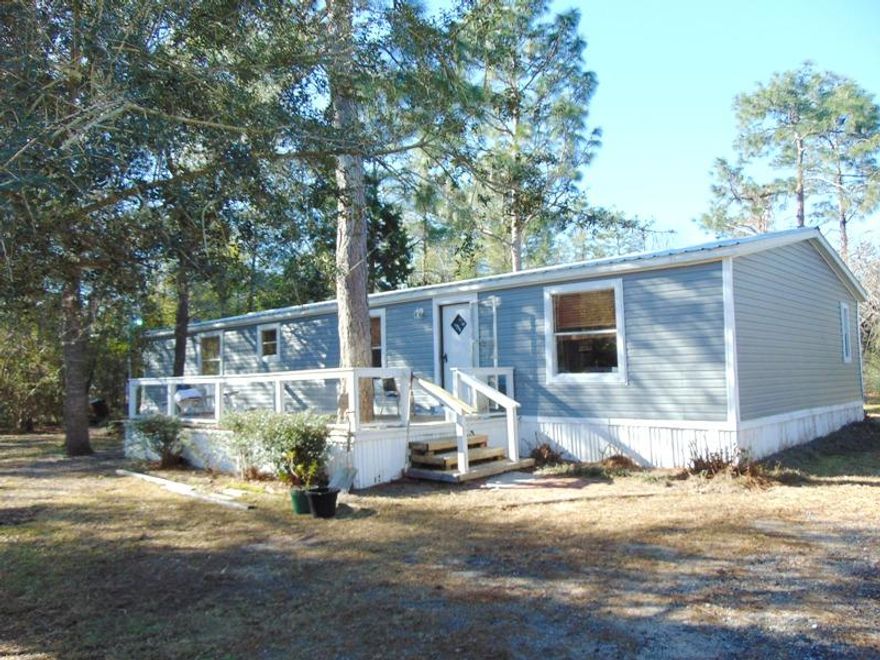 This is a three bedroom two bath mobile home with a split floor plan and a huge living room. There is mold on the ceiling at the back door and in the master bath. So...this will have to be a CASH sale. I don't believe it would take much to repair it, however, it will not finance in the current state it's in.