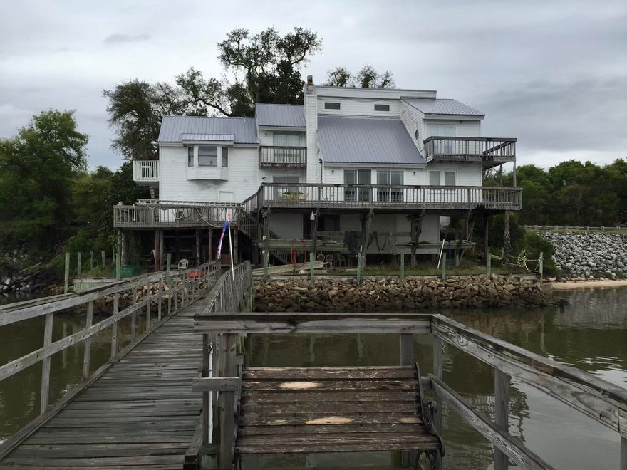 This home is being sold with MLS 873149 (14212 St  Hwy 20) both for $499,000. Two homes for the price of one.  An amazing expansion of Choctawhatchee Bay, the view is spectacular!!!  From east to west, sunrise and sunsets.  Both homes are sold 'AS IS'.  There has been a leak in one of the rooms,  the dock was washed away during the tropical storm Sally but can be repaired per the sellers.  The first floor has a kitchen, dining area, Florida room, living room, bedroom and bath room.  Second floor has two bedrooms and a bathroom.  The laundry room is on the ground floor. Approximately 15 minutes to Destin from MidBay Bridge for shopping, restaurants and more.  Buyer(s) are responsible to personally verify all details for property and dimensions.