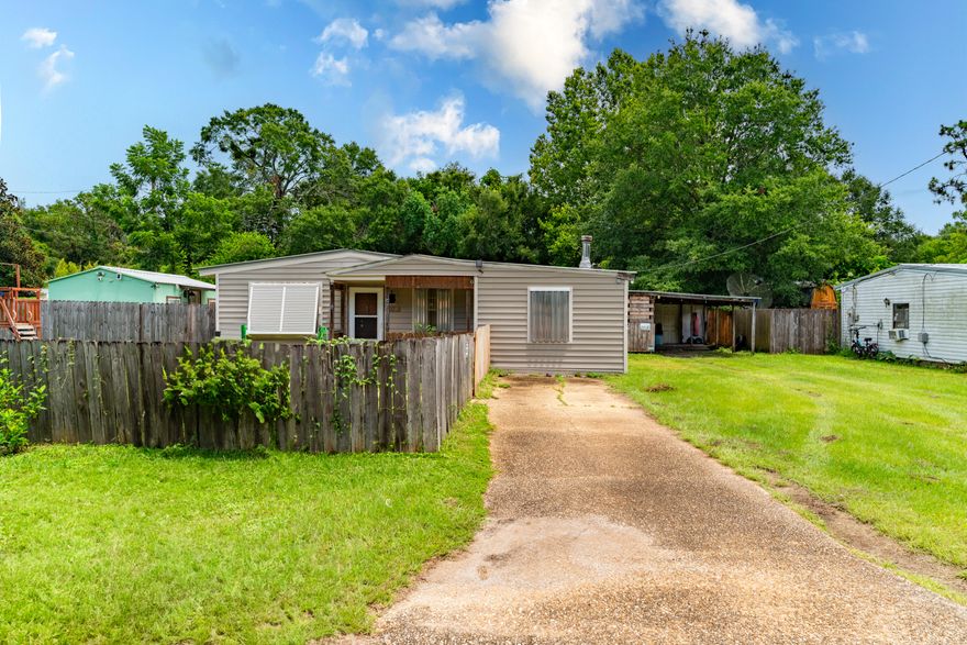 **Sellers are highly motivated** This quaint home sits on a nice corner lot between Stewart St and Dogwood. The three bedrooms are a nice size with closets in each. The one bathroom is light, bright, and easily accessed from the living areas and bedrooms. When you first enter the home, you are welcomed into the living room, with the adjacent dining room as an additional living space. However, that will be optional since this home also features a large bonus room and an eat-in kitchen. This home features an updated kitchen with newer appliances and granite countertops. The home has been rewired and replumbed within the last four years. The home also has a whole home water filtration system. You will also find a workshop, tool shed, and powered she-shed/man cave