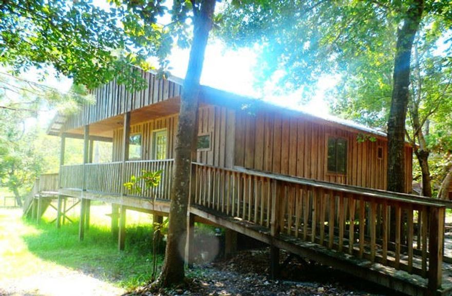 Canal front two bedroom two bathroom cabin on over half of an acre! Peaceful little neighborhood located only ten minutes from the Choctawhatchee Bay and fifteen minutes from the Emerald Coast! This would make a wonderful weekend getaway! Call today for your appointment to see this property. Property to be sold ''AS IS''.