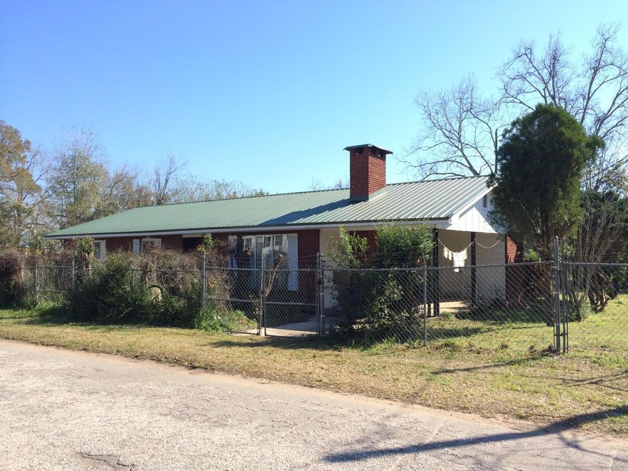 Less than 30mins north from I-10 in Laurel Hill you can enjoy country living at its finest. This home is nestled under large trees on a park like setting. Spacious kitchen & Family room. The yard has many azalea bushes and large hardwood trees. many windows have been updated to energy efficient.Spacious kitchen with plenty of cabinets. Fenced yared front and back. Storage shed. Home is not in a subdivision so no covenants and restrictions or association fees. Buyer to verify any information they deem important. Put this home on your list of homes to see and you won't be disappointed.